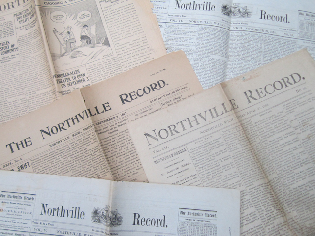 Image of a magnifying glass over the newspaper. Click here to search the Newspaper Archives!
